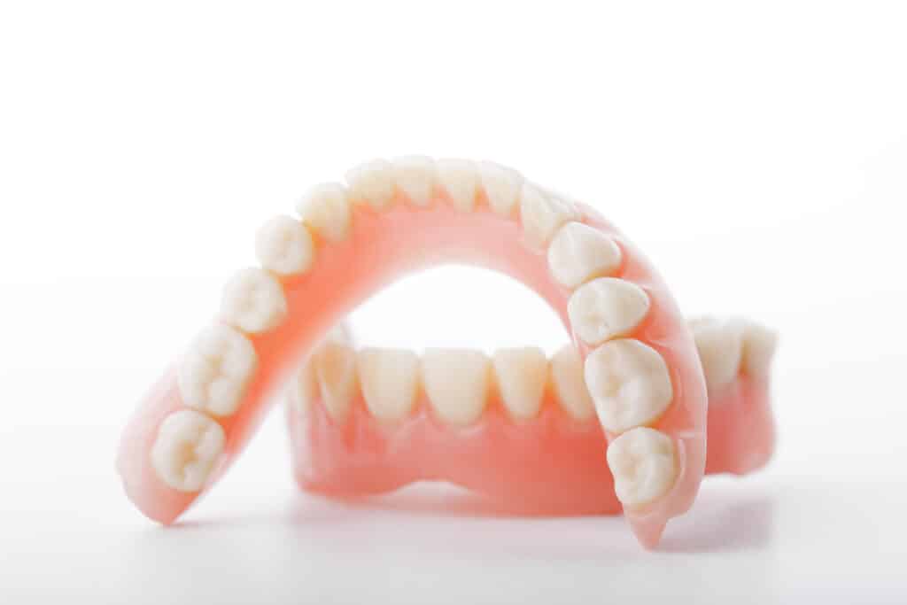 medical denture smile jaws teeth on white background. Finding the Right Dentures for You